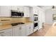 Modern kitchen featuring stainless steel appliances, white cabinetry, and a bright, airy atmosphere at 7920 Aspect Way, Las Vegas, NV 89149