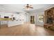 An open-concept floor plan with tiled floors connects the kitchen, fireplace and living area at 7920 Aspect Way, Las Vegas, NV 89149