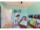 Bright bedroom features colorful decor and a comfortable sitting area at 7928 Violet Dawn St, Las Vegas, NV 89149