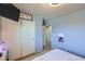 Bedroom features an organized closet with white doors and a mounted TV at 7928 Violet Dawn St, Las Vegas, NV 89149