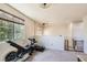 Bonus room features a window with blinds and workout equipment at 7928 Violet Dawn St, Las Vegas, NV 89149