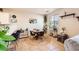Cozy dining area with a round table, stylish chairs, and natural light from the window, perfect for gatherings at 7928 Violet Dawn St, Las Vegas, NV 89149