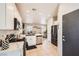Modern kitchen features white cabinets, stainless steel appliances, and marble countertops at 7928 Violet Dawn St, Las Vegas, NV 89149