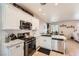 Modern kitchen with stainless steel appliances, granite countertops, a sleek backsplash, and ample cabinet space at 7928 Violet Dawn St, Las Vegas, NV 89149