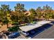 Aerial view showing the building, parking, and lush green trees at 7950 W Flamingo Rd # 1003, Las Vegas, NV 89147