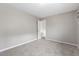 Clean, carpeted bedroom featuring an open closet at 808 Reynolds Ave, North Las Vegas, NV 89030