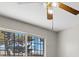 Bedroom featuring a ceiling fan, barred window, and neutral tones to create a blank canvas for a personalized space at 808 Reynolds Ave, North Las Vegas, NV 89030
