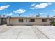 Single-story home with a concrete driveway, white gravel accents, and a basketball hoop for recreational fun at 808 Reynolds Ave, North Las Vegas, NV 89030