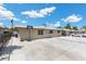 View of the side of the property featuring a driveway and access to the yard with adjacent neighboring property at 808 Reynolds Ave, North Las Vegas, NV 89030