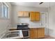 Cozy kitchen featuring wood cabinets, laminate countertops, and stainless steel appliances at 808 Reynolds Ave, North Las Vegas, NV 89030