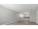 Spacious living room with gray walls and floors, a ceiling fan, and lots of natural light at 808 Reynolds Ave, North Las Vegas, NV 89030