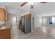 Open concept living area boasts durable flooring, and is connected to the kitchen at 808 Reynolds Ave, North Las Vegas, NV 89030