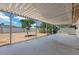 Covered patio with concrete flooring offers an excellent outdoor living space and shade from the sun at 808 Reynolds Ave, North Las Vegas, NV 89030