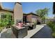 Inviting back patio area with outdoor seating, fireplace, and garden providing a tranquil retreat at 8564 Mayport Dr, Las Vegas, NV 89131