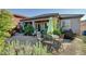 Well-maintained backyard with a patio, gravel, lush plantings and ample space for relaxation and outdoor enjoyment at 8564 Mayport Dr, Las Vegas, NV 89131