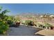 Backyard showcasing desert landscaping, mountain views, and outdoor seating area for relaxation and enjoying the scenery at 8564 Mayport Dr, Las Vegas, NV 89131