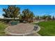 Serene community patio with stone surface and benches perfect for gatherings and relaxation at 8564 Mayport Dr, Las Vegas, NV 89131
