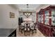 Formal dining room featuring elegant decor, a decorative chandelier, and a beautiful china cabinet at 8564 Mayport Dr, Las Vegas, NV 89131