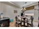 An inviting dining room features a round table and elegant chandelier lighting at 8564 Mayport Dr, Las Vegas, NV 89131