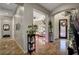 Welcoming foyer with tile flooring, decorative plants, and an open view into the living area at 8564 Mayport Dr, Las Vegas, NV 89131