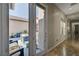 Hallway view through glass doors to the patio area, flooding the space with natural light, enhancing its appeal at 8564 Mayport Dr, Las Vegas, NV 89131