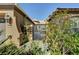 Home exterior featuring desert-friendly landscape and secure courtyard entrance at 8564 Mayport Dr, Las Vegas, NV 89131