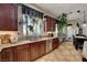 Bright kitchen with granite countertops, custom cabinets, stainless steel appliances, and natural light at 8564 Mayport Dr, Las Vegas, NV 89131