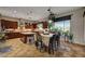 Bright kitchen with granite countertops, eat-in dining area, custom cabinets, and stainless steel appliances at 8564 Mayport Dr, Las Vegas, NV 89131