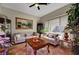 A charming living room with neutral walls and a large bright window at 8564 Mayport Dr, Las Vegas, NV 89131