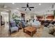 A bright living room boasts tiled floors, a fireplace, and an open floor plan at 8564 Mayport Dr, Las Vegas, NV 89131