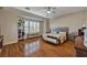 Spacious main bedroom features hardwood floors, a large window, and a comfortable seating area at 8564 Mayport Dr, Las Vegas, NV 89131