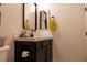 Bathroom with dark vanity, light countertop, with decorative mirror at 862 Silverton Springs St, Henderson, NV 89011