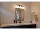 Bathroom featuring single sink vanity with light countertop and dark cabinets at 862 Silverton Springs St, Henderson, NV 89011