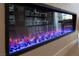 Modern electric fireplace with colorful crystal details and a linear design for a contemporary look at 862 Silverton Springs St, Henderson, NV 89011