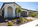 Beautiful single-story home featuring an arched porch entry, neutral paint, tidy landscaping, and brick driveway at 862 Silverton Springs St, Henderson, NV 89011