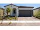 Charming single-story home with a two-car garage, neutral paint scheme, and low-maintenance landscaping at 862 Silverton Springs St, Henderson, NV 89011
