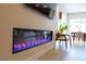 Modern living room featuring an electric fireplace with colorful crystal details and cozy seating area at 862 Silverton Springs St, Henderson, NV 89011