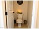 Powder room features modern commode, dark fixtures and bright lighting at 862 Silverton Springs St, Henderson, NV 89011