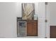Cozy drink bar featuring a mini fridge and an attractive cabinet and counter at 9 Porto Malaga St, Henderson, NV 89011