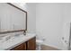 Bathroom featuring a marble countertop, dark wood cabinetry, and a decorative towel at 9 Porto Malaga St, Henderson, NV 89011