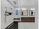 Large bathroom with a glass shower, dual sinks, and white marble floors and shower walls at 9 Porto Malaga St, Henderson, NV 89011