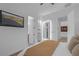Bright bedroom featuring a flat-screen TV, walk-in closet, and illuminated bathroom at 9 Porto Malaga St, Henderson, NV 89011
