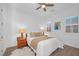 Comfortable bedroom with a ceiling fan, cozy decor, two windows and wood laminate flooring at 9 Porto Malaga St, Henderson, NV 89011