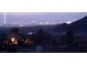 Night view of the cityscape from a hillside neighborhood, with city lights and mountain backdrop at 9 Porto Malaga St, Henderson, NV 89011