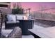 Close-up view of the outdoor seating area with a fire pit and mountain views at 9 Porto Malaga St, Henderson, NV 89011
