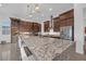 Gourmet kitchen with a large island, stainless steel appliances, and custom cabinetry; perfect for entertaining at 9 Porto Malaga St, Henderson, NV 89011