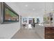 Open-concept living and dining area with modern finishes, a fireplace, and scenic backyard views at 9 Porto Malaga St, Henderson, NV 89011