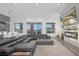 Spacious living room features a cozy fireplace, large windows, and stylish furniture for comfortable living at 9 Porto Malaga St, Henderson, NV 89011