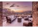 Inviting outdoor patio with fire pit and seating, perfect for enjoying scenic views and evening relaxation at 9 Porto Malaga St, Henderson, NV 89011