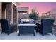 Outdoor patio featuring comfortable seating around a fire pit for cozy evenings at 9 Porto Malaga St, Henderson, NV 89011